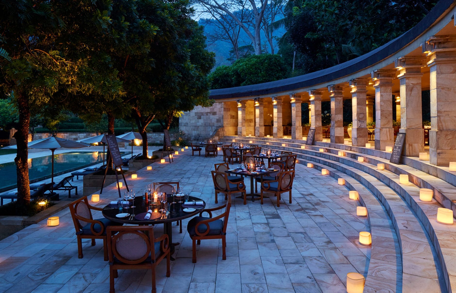 Amanjiwo, Java, Indonesia. Luxury Hotel Review by TravelPlusStyle. Photo © Aman Resorts amanjiwo-indonesia-pool-club-bistro-dinner_high-res_11224