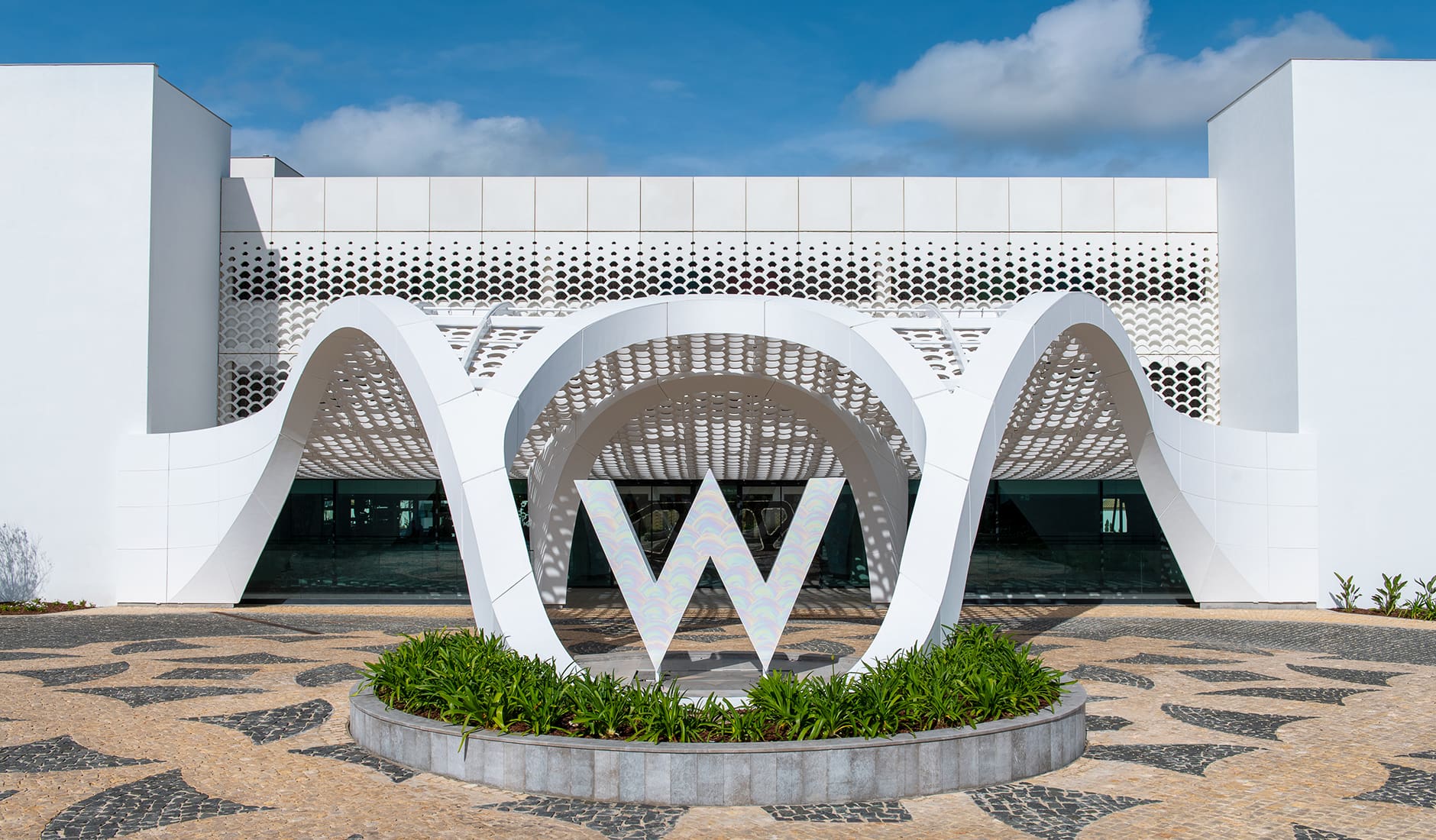 W Algarve Hotel & Residences, Algarve, Portugal. The Best Luxury Hotel Openings of 2022 by TravelPlusStyle.com w-algarve-front-drive-4-22