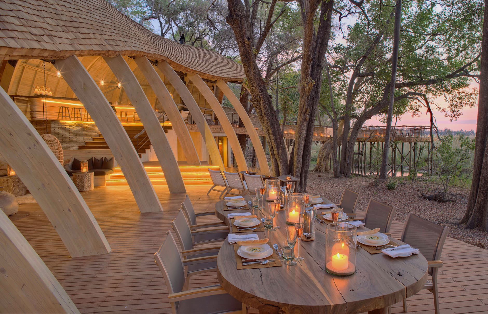 botswana-sandibe-guest-area-dinner-on-deck-at-sunset