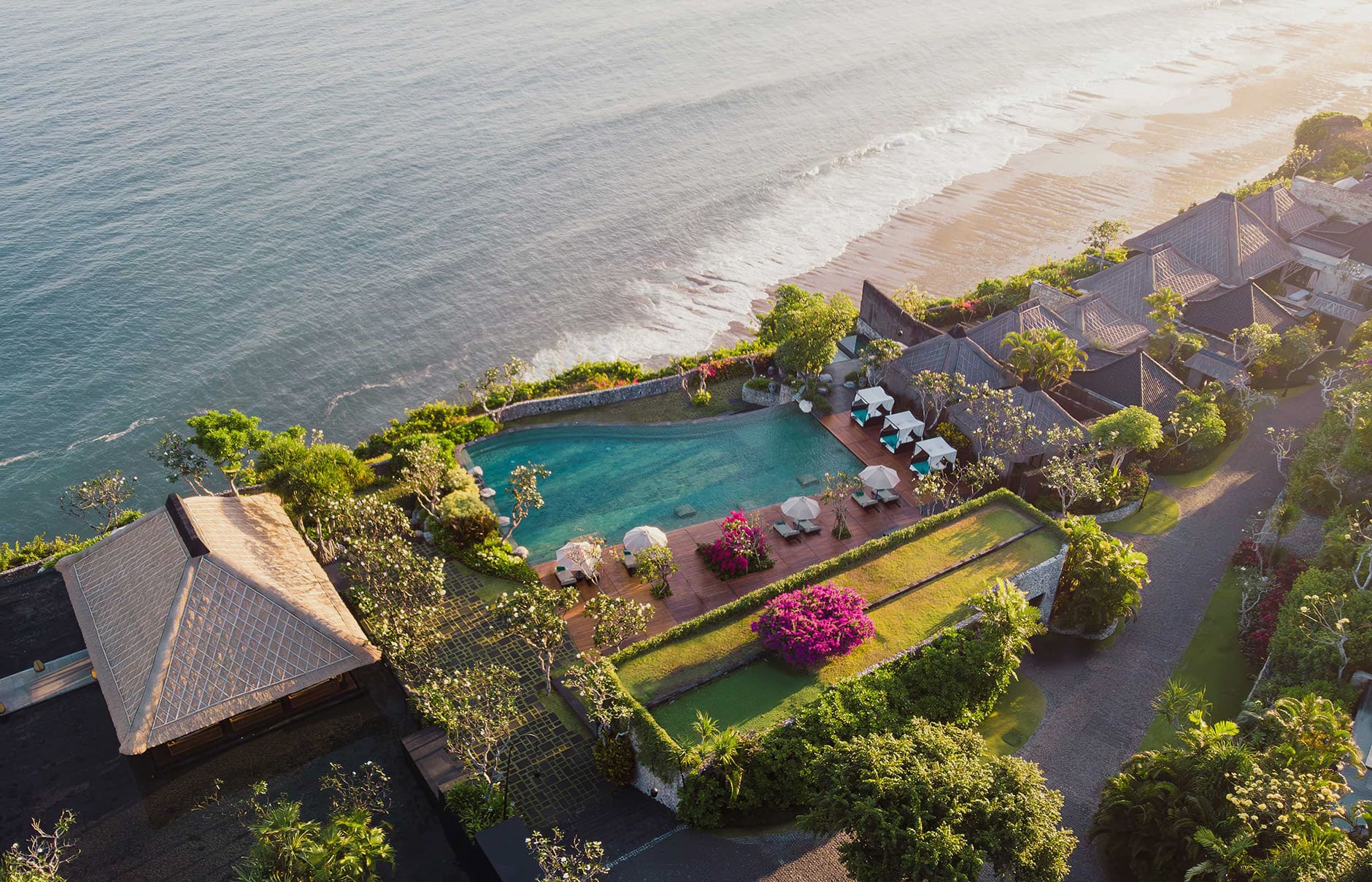 Bulgari Resort Bali, Uluwatu, Indonesia. Luxury Hotel Review by TravelPlusStyle. Photo © Bulgari Hotels & Resorts hero-the-pool-aerial-shot-sunset