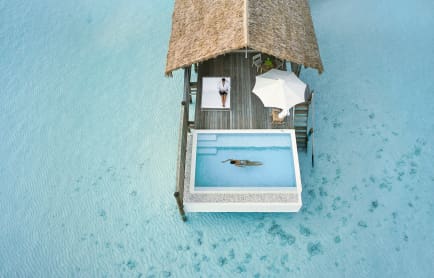 aerial_one-bedroom-water-villa_terrace-with-couple
