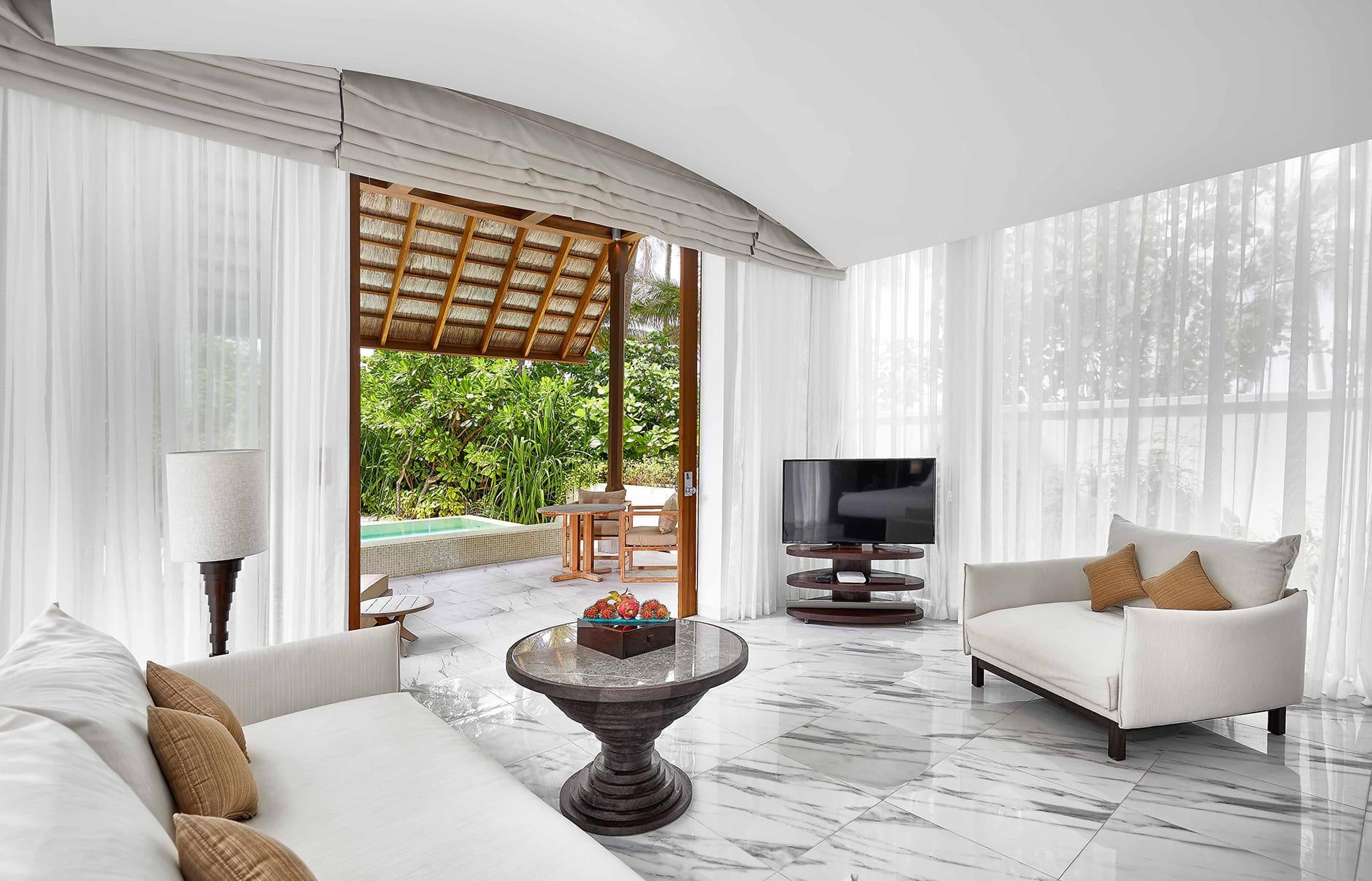 conrad-maldives-villas-deluxe-beach-villa-living-area-credit-justin-nicholas-hi-res-1