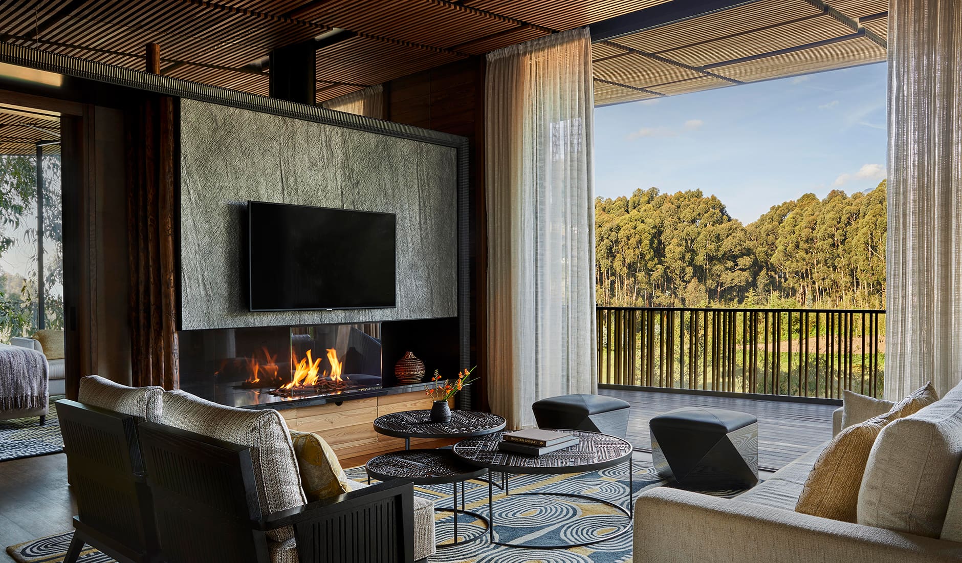 oo_gorillasnest_accommodation_virunga_suite_lounge_wide_08_master_hr