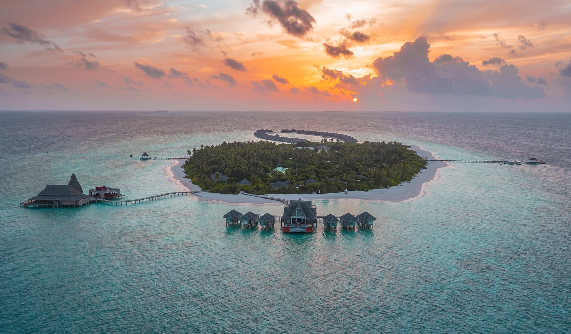 Anantara Kihavah Villas, Baa Atoll, Maldives. The Best Luxury Resorts in the Maldives by TravelPlusStyle.com anantara_kihavah_villas_sunset_aerial-travelplusstyle