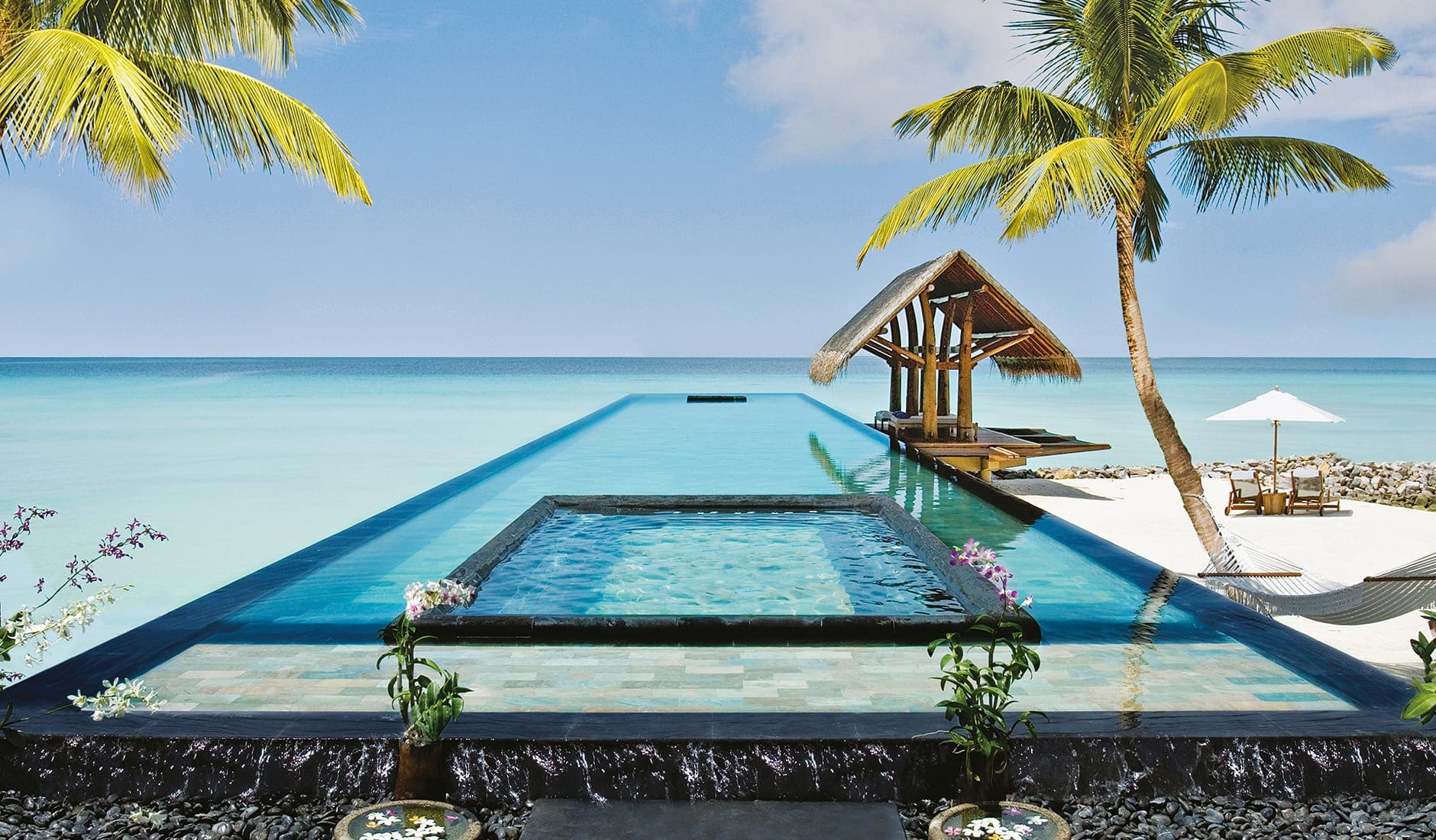 reethi_rah_maldives_pool_beach_travelplusstyle