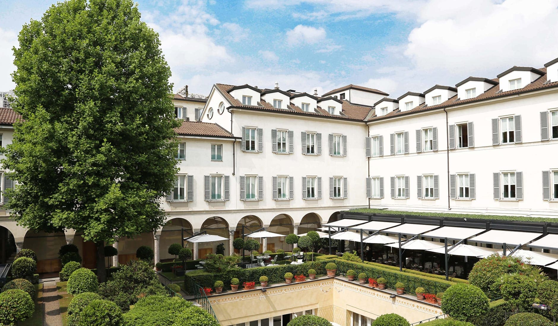 Four Seasons Hotel Milano, Italy. The Best Luxury Hotel Openings of 2021 by TravelPlusStyle.com four-seasons-hotel-milanocloistered-courtyard-four-seasons-hotel-milano-1-scaled