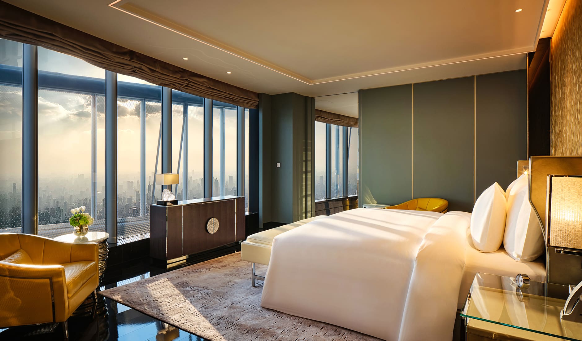 J Hotel, Shanghai Tower, Shanghai, China. The Best Luxury Hotel Openings of 2021 by TravelPlusStyle.com j-suite-bedroom
