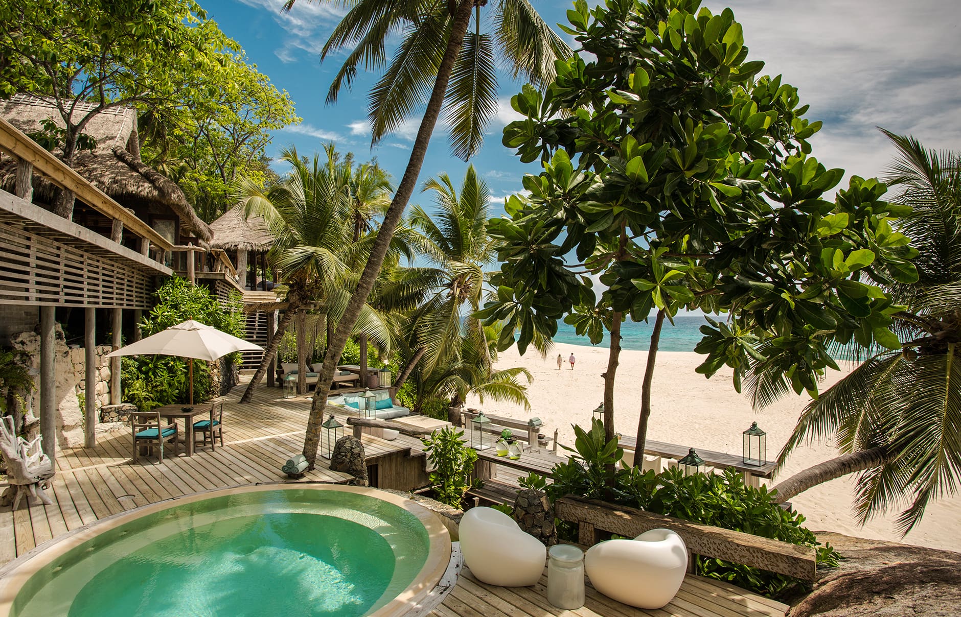 North Island, a Luxury Collection Resort, Seychelles. Luxury Hotel Review by TravelPlusStyle. Photo © North Island north-island-villanorthislandcoupleonthebeach_0