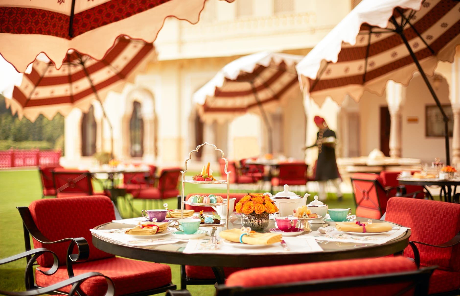 Taj Rambagh Palace, Jaipur, India. Luxury Hotel Review by TravelPlusStyle. Photo © Taj Hotels Resorts and Palaces hi_h4ej0_67917682_trpj_lawn_verandah_cafe_8515