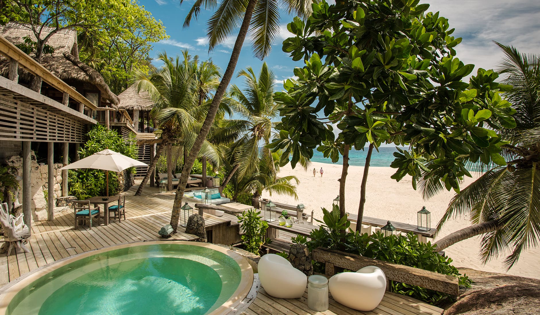 North Island, a Luxury Collection Resort, Seychelles. The Best Luxury Resorts in the Seychelles. TravelPlusStyle.com north-island1100-villanorthislandcoupleonthebeach