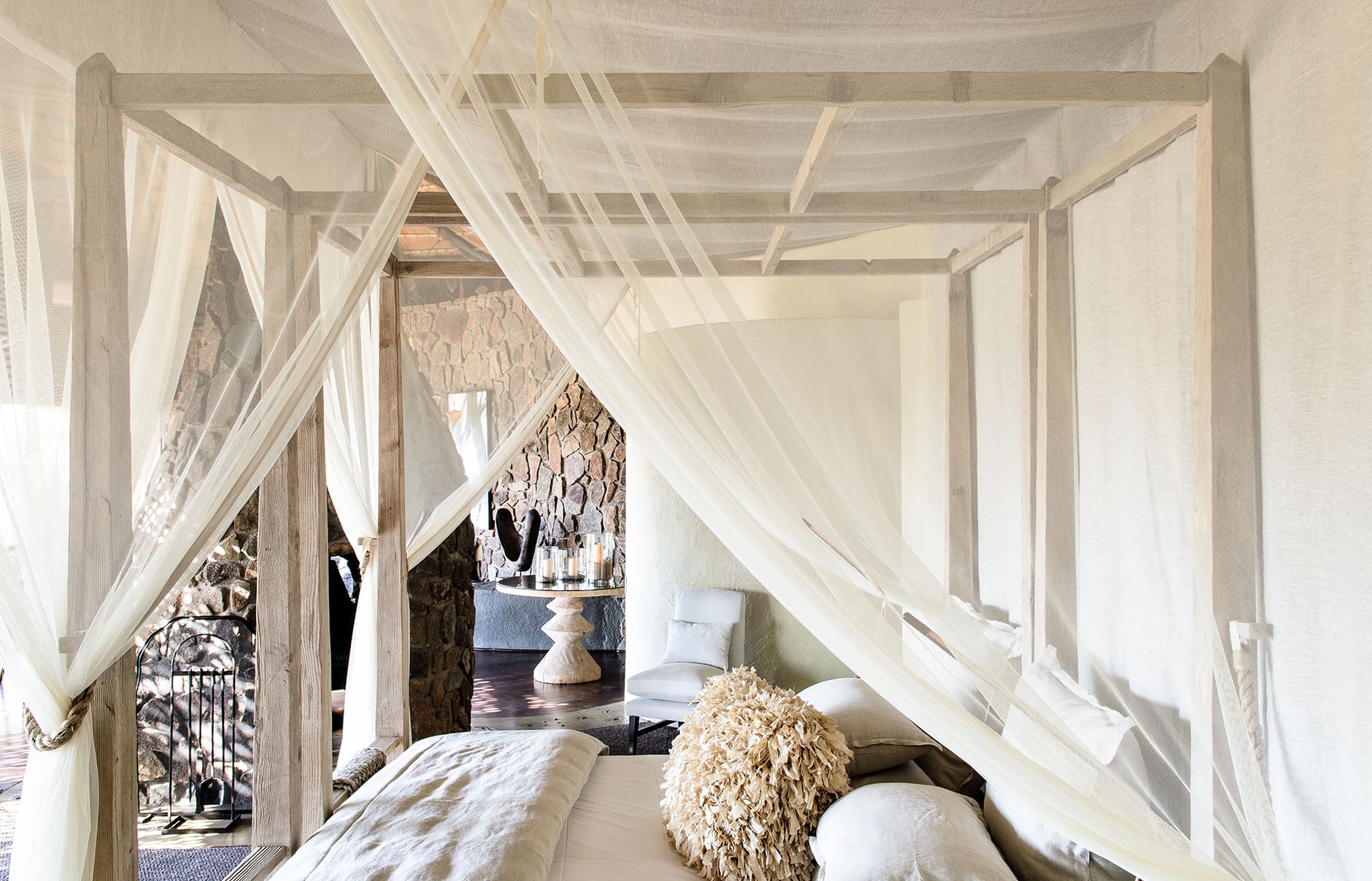 singita-boulders-lodge_river-suite-bedroom-with-view-of-plungepool